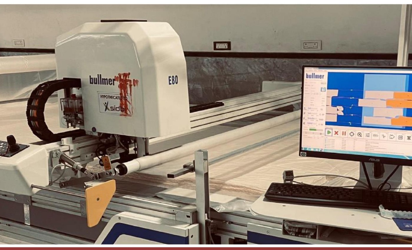 Computer-controlled fabric cutting equipment